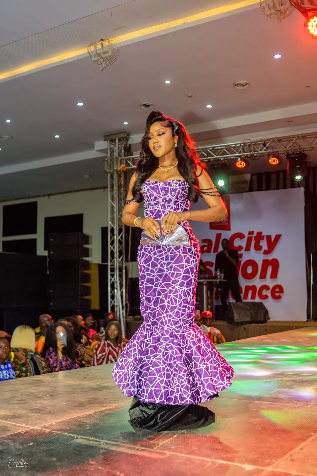 On the runway in a purple Ankara mermaid gown